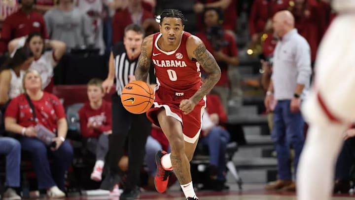 Alabama guard Labaron Philon (0) dribbles down the court against Arkansas at Bud Walton Arena in Fayetteville, AR on Saturday, Feb 8, 2025.