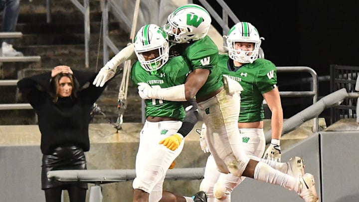 Weddington's #0 TJ Davis took the ball in for a touchdown after a blocked punt as Hoggard took on Weddington High School in the 4A Football Championship at Carter-Finley Stadium in Raleigh Saturday Dec. 9, 2023. Weddington beat Hoggard 56 -21 to win the State Championship. KEN BLEVINS/STARNEWS