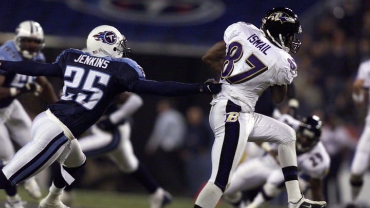 -

-Text: GW TITANS RAVENS...Titans cornerback DeRon Jenkins grabs Ravens wide receiver Qadry Ismail after he caught a pass from Ravens QB Elvis Grbac at Adelphia Colesium. 11/12/01 photo--George Walker IV/Staff

Title Tennessee Titans Vs Baltimore Ravens Football