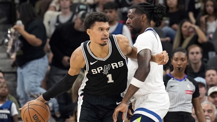 Nov 2, 2024; San Antonio, Texas, USA; San Antonio Spurs center Victor Wembanyama (1) drives to the basket while defended by Minnesota Timberwolves center Naz Reid (11) during the first half at Frost Bank Center.