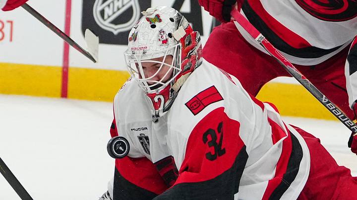 Jun 14, 2026; Las Vegas, Nevada, USA; Carolina Hurricanes goaltender Brandon Bussi (32) blocks a shot by the Vegas Golden Knights during the first period in game six of the 2026 Stanley Cup Final at T-Mobile Arena. Mandatory Credit: Stephen R. Sylvanie-Imagn Images