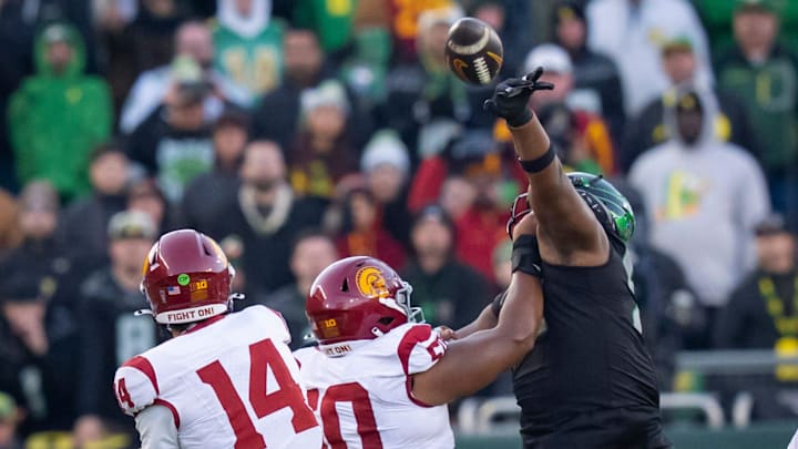Oregon defensive lineman A'Mauri Washington blocks a pass by USC quarterback Jayden Maiava as the Oregon Ducks host the USC Trojans on Nov. 22, 2025, at Autzen Stadium in Eugene, Oregon.