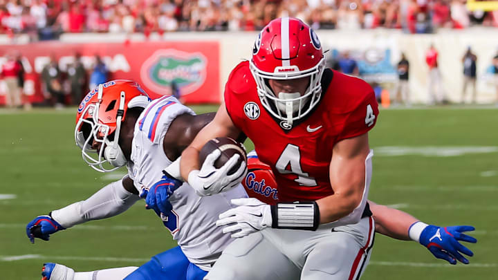 Florida Gators linebacker Shemar James (6) pushes Georgia Bulldogs tight end Oscar Delp (4) out of bounds during the first half at EverBank Stadium in Jacksonville, FL on Saturday, November 2, 2024. [Doug Engle/Gainesville Sun]