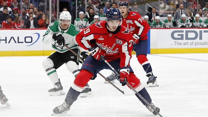 Oct 17, 2024; Washington, District of Columbia, USA; Washington Capitals center Hendrix Lapierre (29) skates with the puck as Dallas Stars center Sam Steel (18) chases in the first period at Capital One Arena. Mandatory Credit: Geoff Burke-Imagn Images