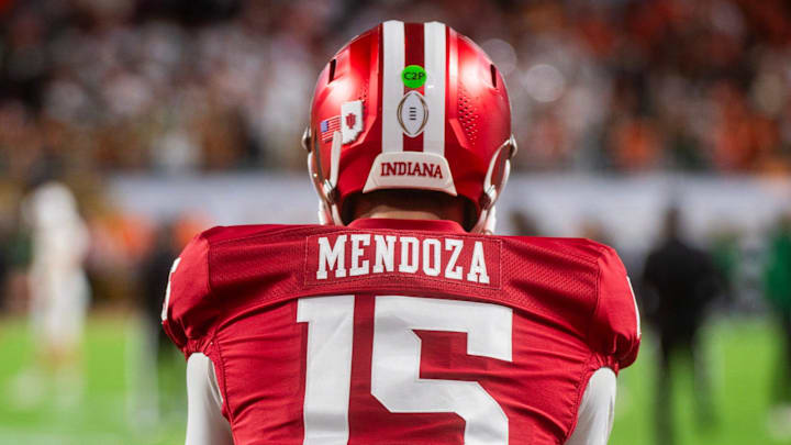Indiana's Fernando Mendoza (15) gets loose before the College Football Playoff National Championship college football game at Hard Rock Stadium in Miami Gardens on Monday, Jan. 19, 2026.