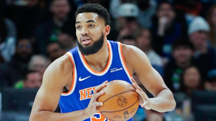 Dec 19, 2024; Minneapolis, Minnesota, USA; New York Knicks forward Karl-Anthony Towns (32) grabs a rebound from the Minnesota Timberwolves in the first quarter at Target Center. Mandatory Credit: Bruce Kluckhohn-Imagn Images