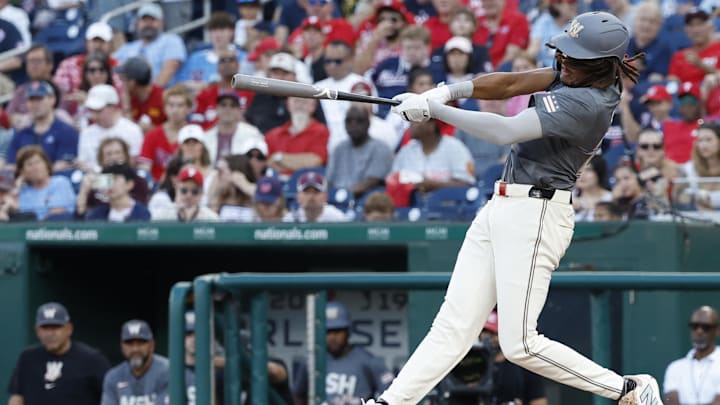 Sep 28, 2024; Washington, District of Columbia, USA; Washington Nationals outfielder James Wood (29) hits a two run home run against the Philadelphia Phillies during the sixth inning at Nationals Park. 