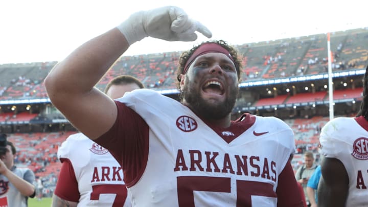 Arkansas Razorbacks offensive lineman Fernando Carmona (55) celebrates with fans after the Razorbacks beat the Auburn Tigers at Jordan-Hare Stadium. Mandatory Credit: John Reed-Imagn Images