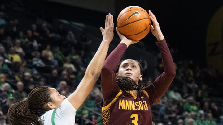 Minnesota’s Amaya Battle, right, shoots around Oregon’s Sofia Bell during the first half at Matthew Knight Arena in Eugene Jan. 21, 2026.