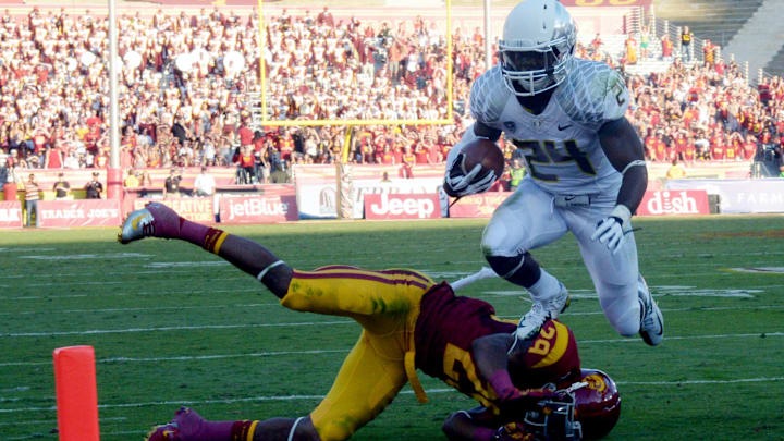 All-American Kenjon Barner gashed USC for a school record 321 yards and five touchdowns in 2012, and Saturday he scorched them again with some pointed advice on his podcast. Mandatory Credit: Kirby Lee/Image of Sport-Imagn Images
