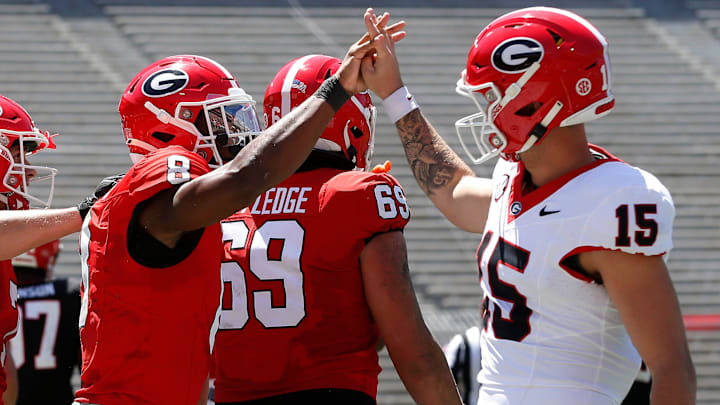 Georgia wide receiver Colbie Young (8) coal celebrates with Georgia quarterback Carson Beck (15)