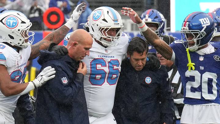 Sep 27, 2026; East Rutherford, New Jersey, USA; Tennessee Titans guard Fernando Carmona Jr. (66) is helped off the field after an apparent injury during the first quarter against the New York Giants at MetLife Stadium. Mandatory Credit: Robert Deutsch-Imagn Images Sep 27, 2026; East Rutherford, New Jersey, USA; Tennessee Titans guard Fernando Carmona Jr. (66) is helped off the field after an apparent injury during the first quarter against the New York Giants at MetLife Stadium. Mandatory Credit: Robert Deutsch-Imagn Images