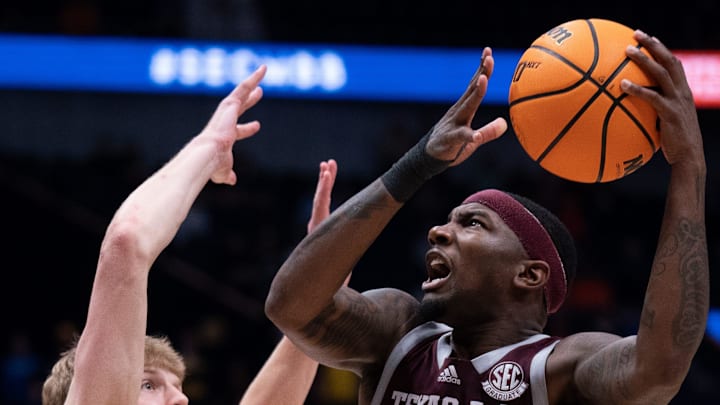 Texas A&M Aggies guard Tyrece Radford (23) shoots over Florida Gators forward Thomas Haugh (10)