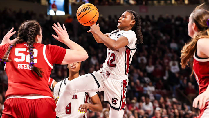 Jan 19, 2025; Columbia, South Carolina, USA; South Carolina Gamecocks guard MiLaysia Fulwiley (12) drives over Oklahoma Sooners center Raegan Beers (52) in the first half at Colonial Life Arena. Mandatory Credit: Jeff Blake-Imagn Images