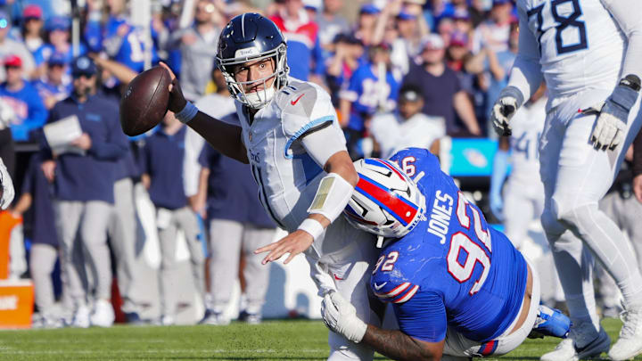 Oct 20, 2024; Orchard Park, New York, USA; Buffalo Bills defensive tackle DaQuan Jones (92) sacks Tennessee Titans quarterback Mason Rudolph (11)