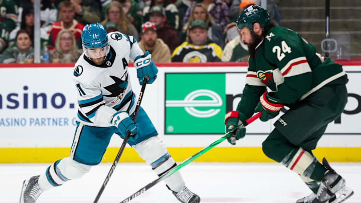 Mar 28, 2024; Saint Paul, Minnesota, USA; San Jose Sharks center Luke Kunin (11) shoots as Minnesota