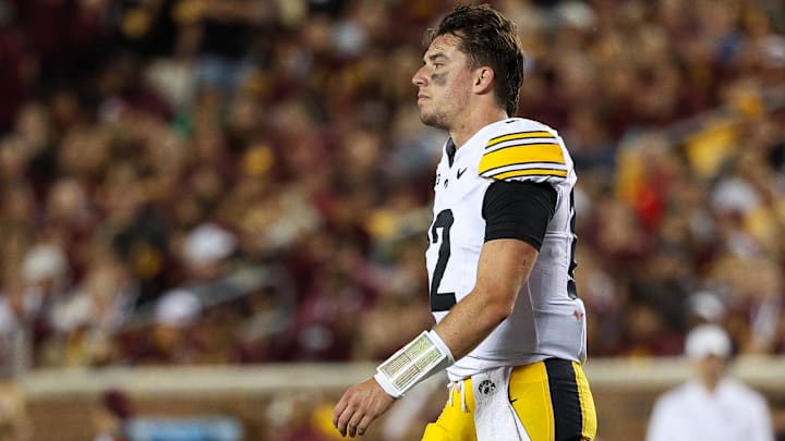Sep 21, 2024; Minneapolis, Minnesota, USA; Iowa Hawkeyes quarterback Cade McNamara (12) looks on during the second half against the Minnesota Golden Gophers at Huntington Bank Stadium. Mandatory Credit: Matt Krohn-Imagn Images