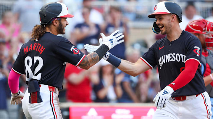 Minnesota Twins left fielder Trevor Larnach celebrates his three-run home run with center fielder Austin Martin (82) against the St. Louis Cardinals during the third inning at Target Field in Minneapolis on Aug. 24, 2024. Minnesota Twins left fielder Trevor Larnach celebrates his three-run home run with center fielder Austin Martin (82) against the St. Louis Cardinals during the third inning at Target Field in Minneapolis on Aug. 24, 2024.