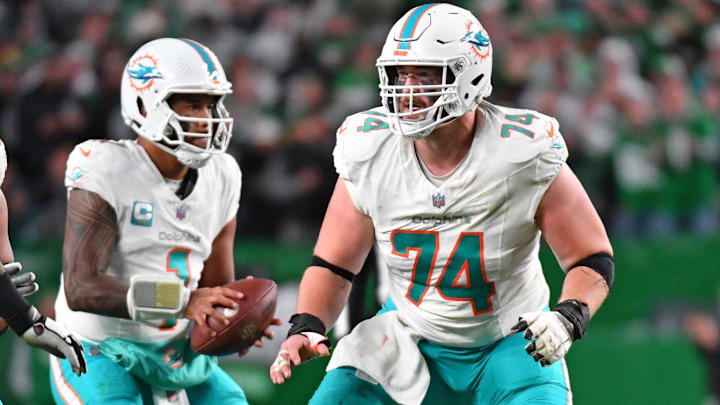 Miami Dolphins quarterback Tua Tagovailoa and OL Liam Eichenberg (74)