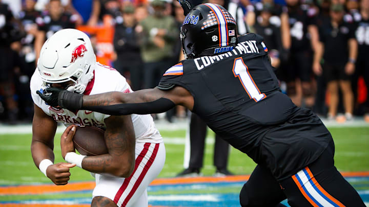 Arkansas Razorbacks quarterback KJ Jefferson is tackled by Florida Gators defensive end Princely Umanmielen in the first half at Steve Spurrier Field at Ben Hill Griffin Stadium in Gainesville, FL on Saturday, November 4, 2023. Arkansas Razorbacks quarterback KJ Jefferson is tackled by Florida Gators defensive end Princely Umanmielen in the first half at Steve Spurrier Field at Ben Hill Griffin Stadium in Gainesville, FL on Saturday, November 4, 2023.