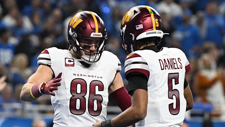 Jan 18, 2025; Detroit, Michigan, USA; Washington Commanders tight end Zach Ertz (86) celebrates touchdown pass with quarterback Jayden Daniels (5) during the second quarter in a 2025 NFC divisional round game at Ford Field. Mandatory Credit: Lon Horwedel-Imagn Images