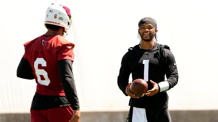 Arizona Cardinals quarterback Kyler Murray (1) talks to running back James Conner (6) during minicamp at Dignity Health Training Center on June 11, 2024.