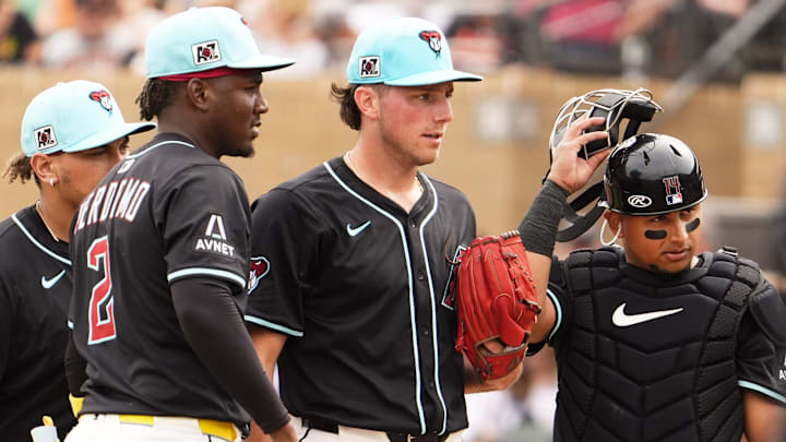 Arizona Diamondbacks pitcher Brandon Pfaadt watches manager Torey Lovullo approach the mound to make a pitching change against the San Francisco Giants in the second inning during a spring training game at Salt River Fields on March 5, 2025, in Scottsdale.