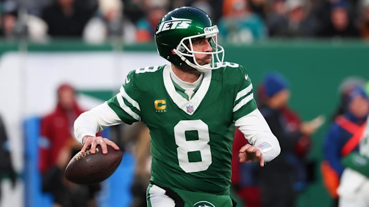 Jan 5, 2025; East Rutherford, New Jersey, USA; New York Jets quarterback Aaron Rodgers (8) throws a pass during the first quarter of their game against the Miami Dolphins at MetLife Stadium. Mandatory Credit: Ed Mulholland-Imagn Images
