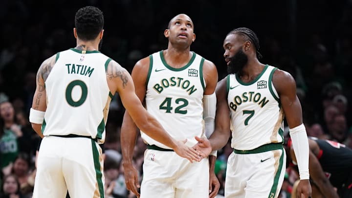 Nov 28, 2023; Boston, Massachusetts, USA; Boston Celtics guard Jaylen Brown (7) with forward Jayson Tatum (0) and center Al Horford (42) after his basket against the Chicago Bulls in the second half at TD Garden. Mandatory Credit: David Butler II-Imagn Images