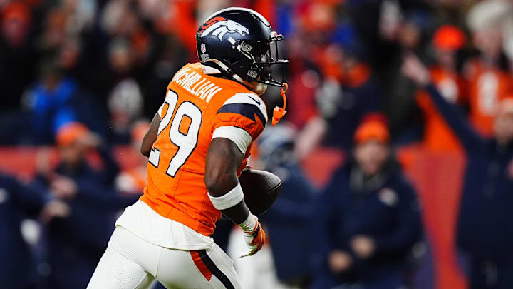 Jan 17, 2026; Denver, CO, USA; Denver Broncos cornerback Ja'quan McMillian (29) celebrates after intercepting a pass intended for Buffalo Bills wide receiver Brandin Cooks (not pictured) during overtime of an AFC Divisional Round playoff game at Empower Field at Mile High. Mandatory Credit: Ron Chenoy-Imagn Images