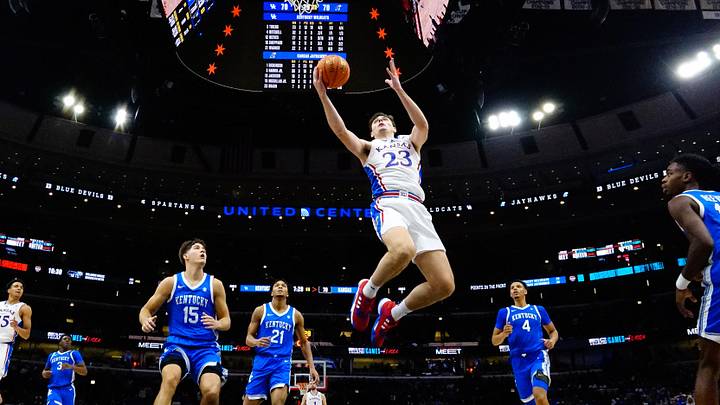 Nov 14, 2023; Chicago, Illinois, USA; Kansas Jayhawks forward Parker Braun (23) scores against the Kentucky Wildcats during the second half at United Center. Mandatory Credit: David Banks-Imagn Images