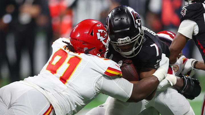 Kansas City Chiefs defensive tackle Derrick Nnadi (91) tackles Atlanta Falcons running back Bijan Robinson