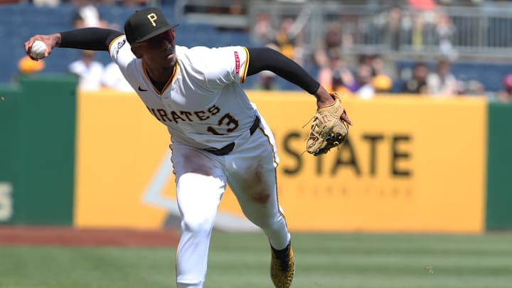 Jun 22, 2025; Pittsburgh, Pennsylvania, USA;  Pittsburgh Pirates third baseman Ke'Bryan Hayes (13) makes a bare-handed play on a ball hit for a single by Texas Rangers right fielder Adolis García during the fifth inning at PNC Park. Mandatory Credit: Charles LeClaire-Imagn Images