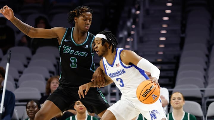 Mar 15, 2025; Fort Worth, TX, USA; Memphis Tigers guard Colby Rogers (3) controls the ball as Tulane Green Wave guard Kam Williams (3) defends during the first half at Dickies Arena.