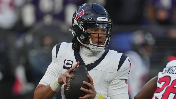 Jan 20, 2024; Baltimore, MD, USA; Houston Texans quarterback C.J. Stroud (7) drops back to pass against the Baltimore Ravens in the first half of a 2024 AFC divisional round game at M&T Bank Stadium. Mandatory Credit: Mitch Stringer-USA TODAY Sports