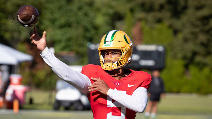 Oregon quarterback Dante Moore throws out a pass during practice with the Oregon Ducks Wednesday, Aug. 28, 2024 at the Hatfield-Dowlin Complex in Eugene, Ore.