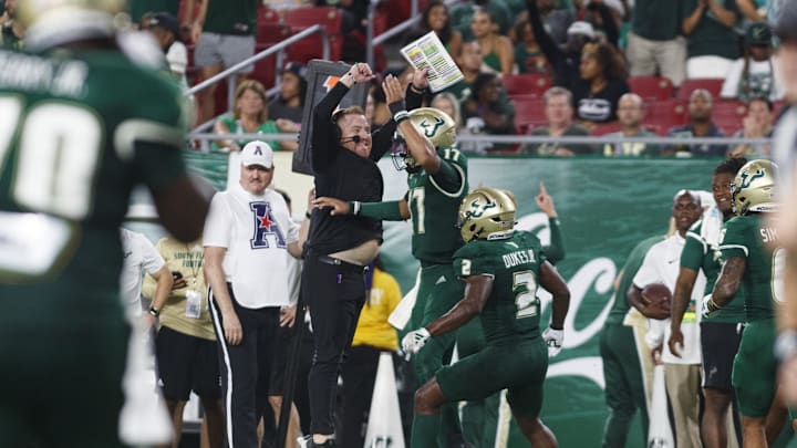 Sep 9, 2023; Tampa, Florida, USA; South Florida Bulls head coach Alex Golesh celebrates quarterback Byrum Brown (17) touchdown against Florida A&M Rattlers during the third quarter at Raymond James Stadium. Mandatory Credit: Morgan Tencza-USA TODAY Sports
