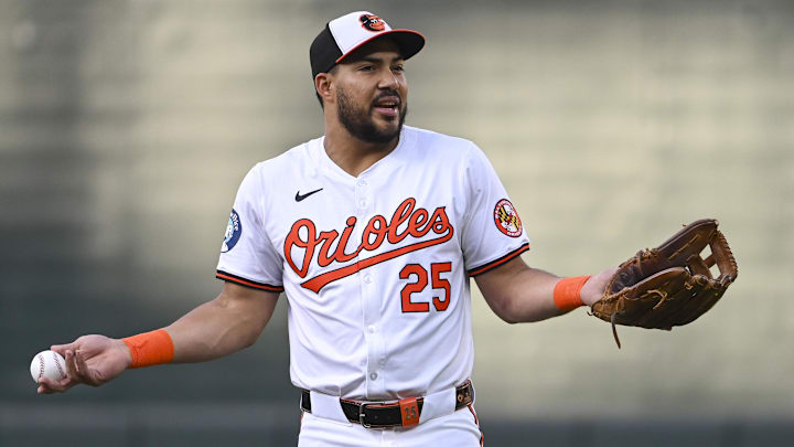 Sep 4, 2024; Baltimore, Maryland, USA; Baltimore Orioles outfielder Anthony Santander (25) reacts while speaking with teammate sin the field before the game against the Chicago White Sox at Oriole Park at Camden Yards. Sep 4, 2024; Baltimore, Maryland, USA; Baltimore Orioles outfielder Anthony Santander (25) reacts while speaking with teammate sin the field before the game against the Chicago White Sox at Oriole Park at Camden Yards.