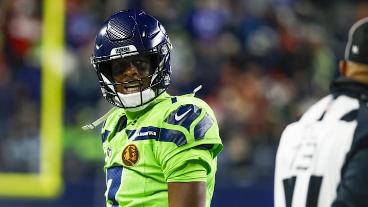 Seattle Seahawks quarterback Geno Smith reacts towards a referee