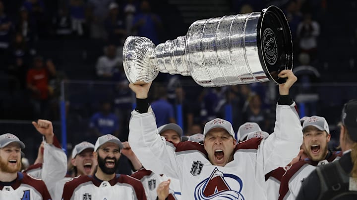 Jun 26, 2022; Tampa, Florida, USA; Colorado Avalanche defenseman Jack Johnson (3) celebrates with the Stanley Cup after the Avalanche game against the Tampa Bay Lightning in game six of the 2022 Stanley Cup Final at Amalie Arena. Mandatory Credit: Geoff Burke-Imagn Images
