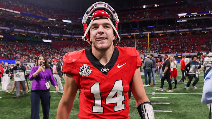 Nov 28, 2025; Atlanta, Georgia, USA; Georgia Bulldogs quarterback Gunner Stockton (14) celebrates after a victory over the Georgia Tech Yellow Jackets at Mercedes-Benz Stadium. Mandatory Credit: Brett Davis-Imagn Images
