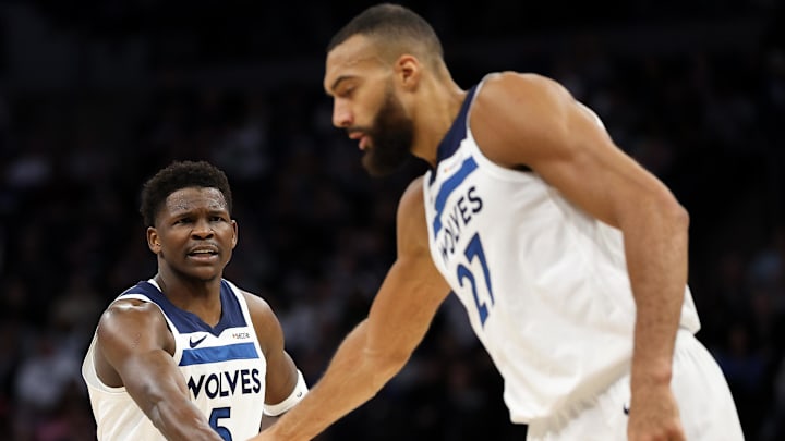 Minnesota Timberwolves guard Anthony Edwards talks to center Rudy Gobert (27) during the first quarter against the Detroit Pistons at Target Center in Minneapolis on March 30, 2025.