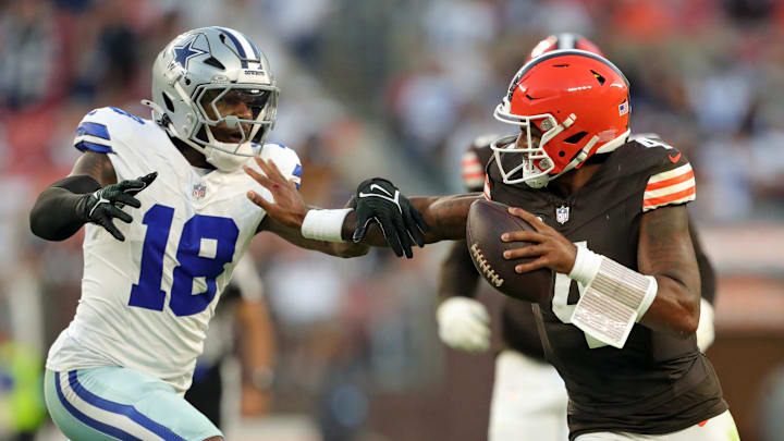 Cleveland Browns quarterback Deshaun Watson (4) runs for yards against Dallas Cowboys linebacker Damone Clark (18) during the second half of an NFL football game at Huntington Bank Field, Sunday, Sept. 8, 2024, in Cleveland, Ohio.