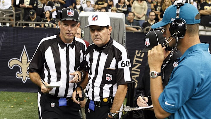 September 23, 2012; New Orleans, LA, USA;  Line judge Chuck Townsend (121) referee Don King (60) and other replacement officials exit the replay booth after a challenge during second half of the Kansas City Chiefs and New Orleans Saints game at the Mercedes-Benz Superdome. The Kansas City Chiefs defeated the New Orleans Saints 27-24 in overtime.  Mandatory Credit: John David Mercer-Imagn Images