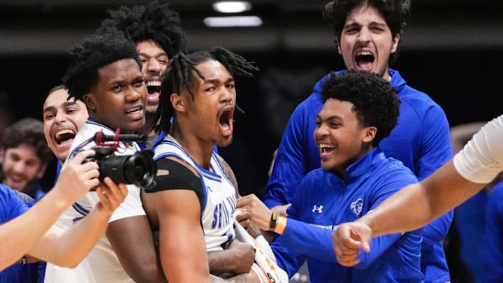 Seton Hall Pirates guard Dre Davis (14) yells in excitement Thursday, April 4, 2024, after winning
