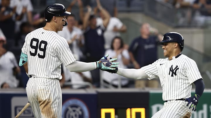 Jul 19, 2024; Bronx, New York, USA;  New York Yankees right fielder Juan Soto (22) is greeted by designated hitter Aaron Judge (99) after scoring in the fourth inning against the Tampa Bay Rays at Yankee Stadium. Mandatory Credit: Wendell Cruz-Imagn Images