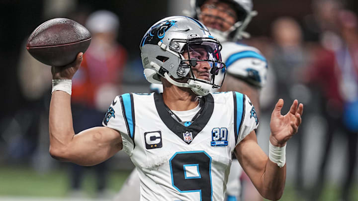 Carolina Panthers quarterback Bryce Young (9) passes on the run against the Atlanta Falcons during the second half at Mercedes-Benz Stadium. 