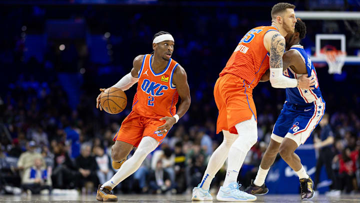 Jan 14, 2025; Philadelphia, Pennsylvania, USA; Oklahoma City Thunder guard Shai Gilgeous-Alexander (2) controls the ball against the Philadelphia 76ers during the fourth quarter at Wells Fargo Center. Mandatory Credit: Bill Streicher-Imagn Images