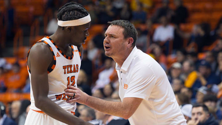 UTEP's head men’s basketball coach Joe Golding talks to Ahamad Bynum Jr. (12) during a men's basketball game against Kennesaw State on Saturday, Jan. 25, 2025, at the Don Haskins Center in El Paso, Texas.