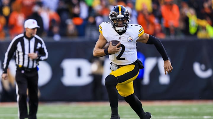 Dec 1, 2024; Cincinnati, Ohio, USA; Pittsburgh Steelers quarterback Justin Fields (2) runs with the ball against the Cincinnati Bengals in the second half at Paycor Stadium. Mandatory Credit: Katie Stratman-Imagn Images
